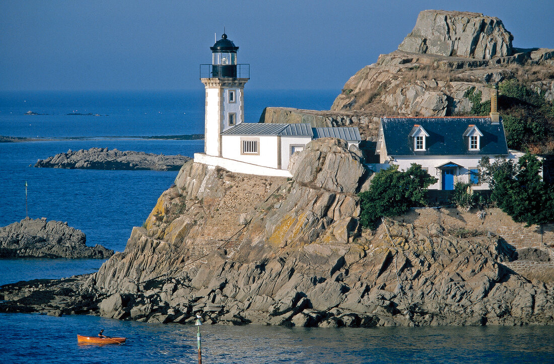 Lighthouse on rocky coast at Carantec in Brittany, France
