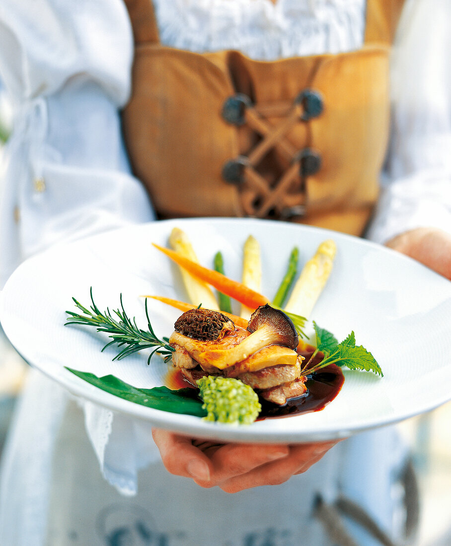 Veal with foie grass, mushrooms and risotto on plate