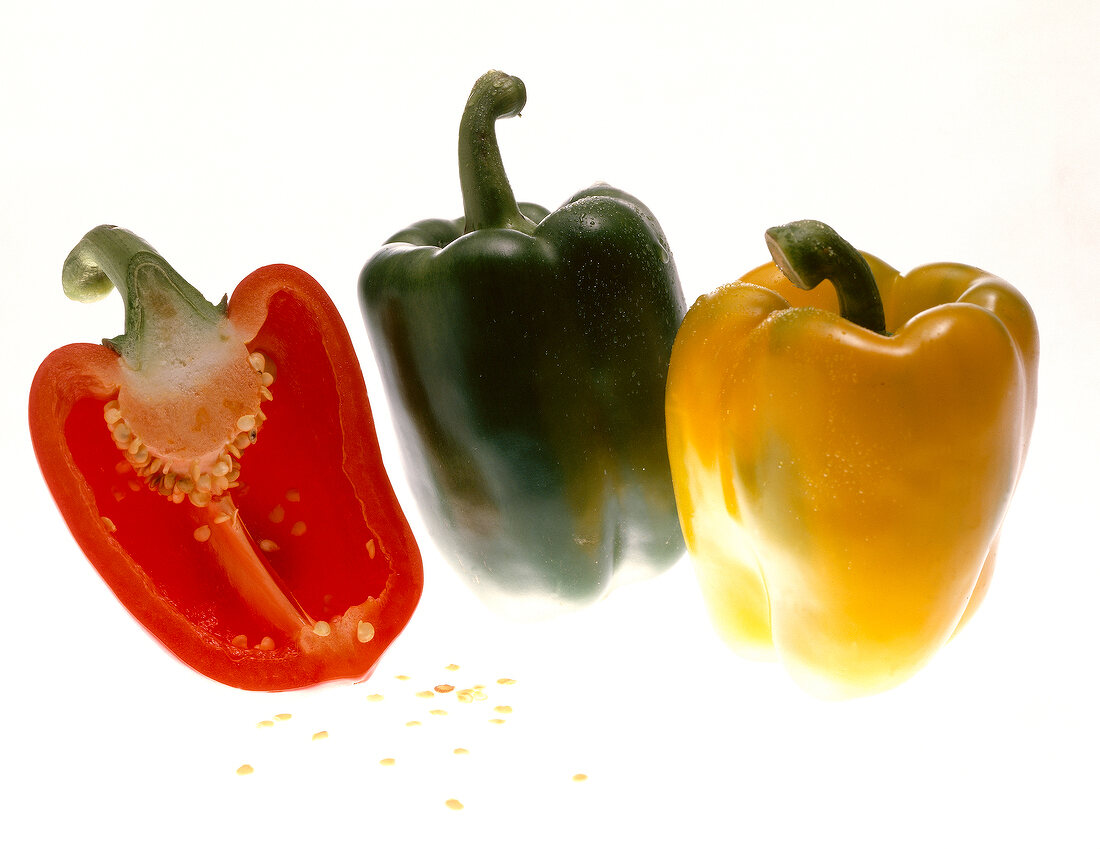 Red, yellow and green pepper on white background