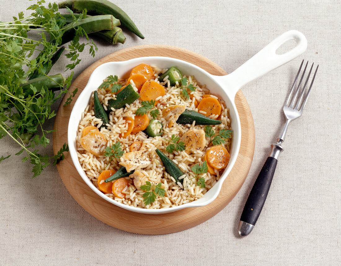 Vegetable fried rice with chicken fillet in pan