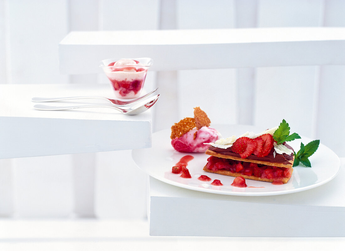 Strawberries on sable breton with rhubarb ice cream on plate