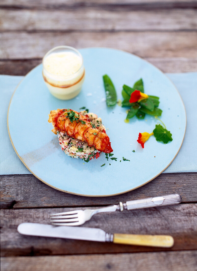 Lobster with coconut cappuccino served on plate