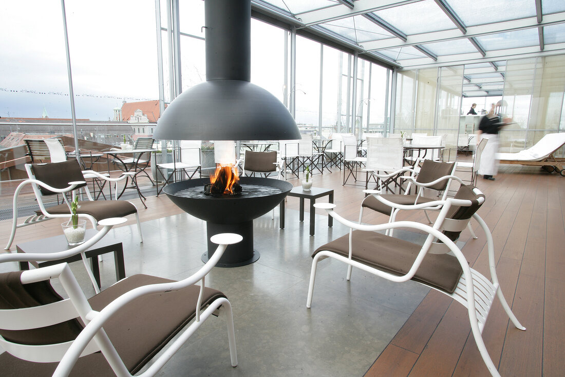 Sitting area with fireplace in hotel, Germany