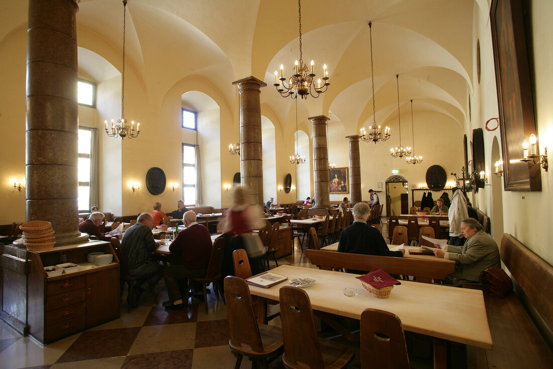People sitting at table in restaurant, Germany