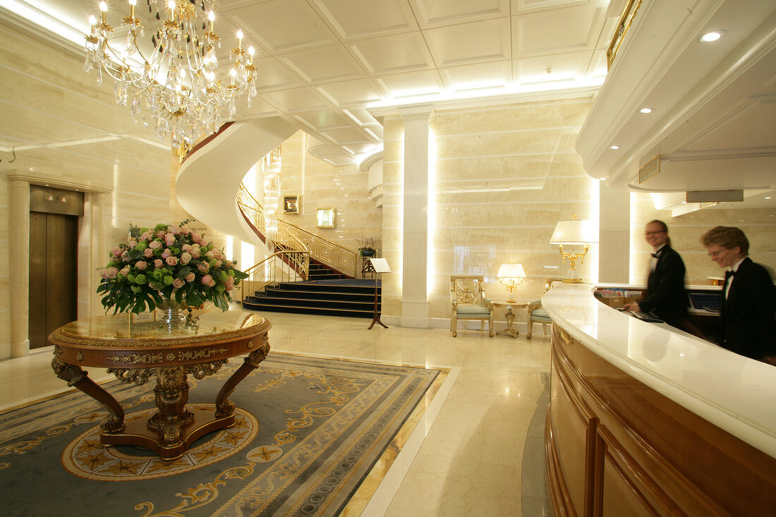 Receptionist at reception counter in hotel, Switzerland