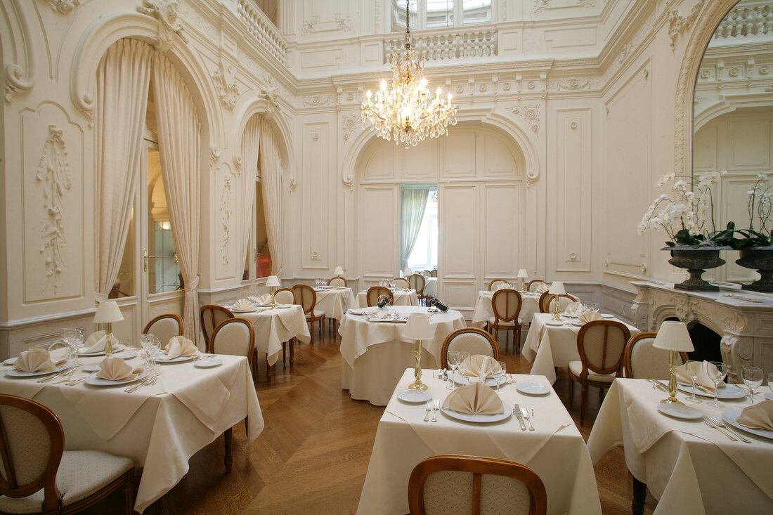 Dining tables arranged in hotel, Belgium