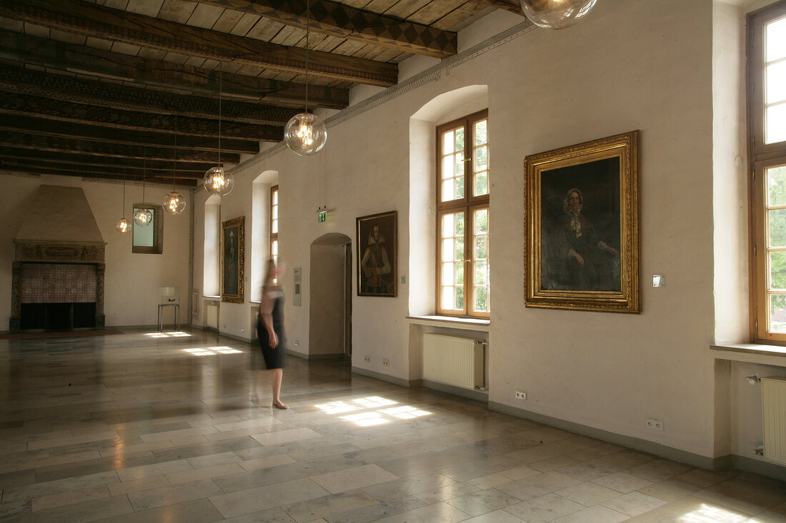 Woman standing in hall, Germany