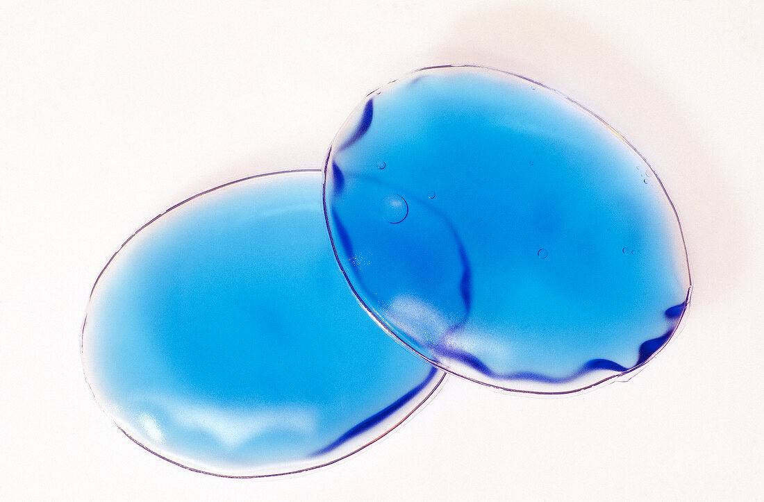 Close-up of heating pads on white background