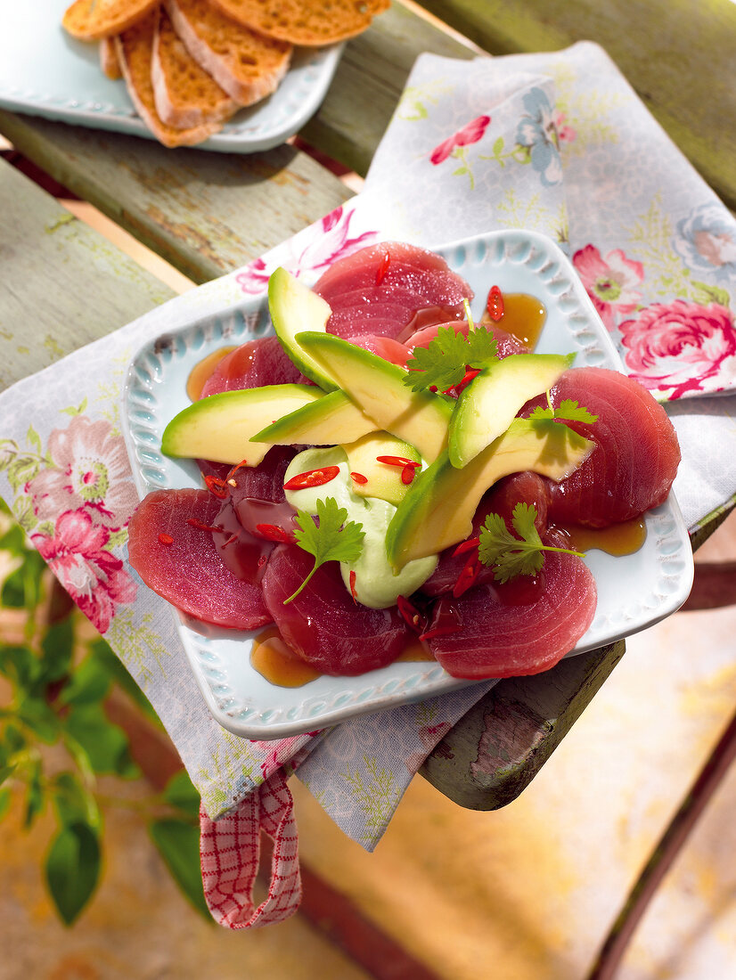 Close-up of tuna carpaccio on serving dish