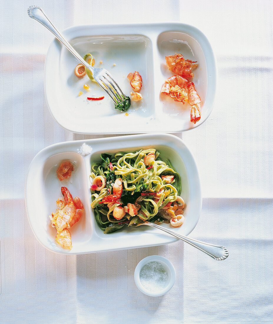 Mustard fruits with crustacean and fettuccine on plate