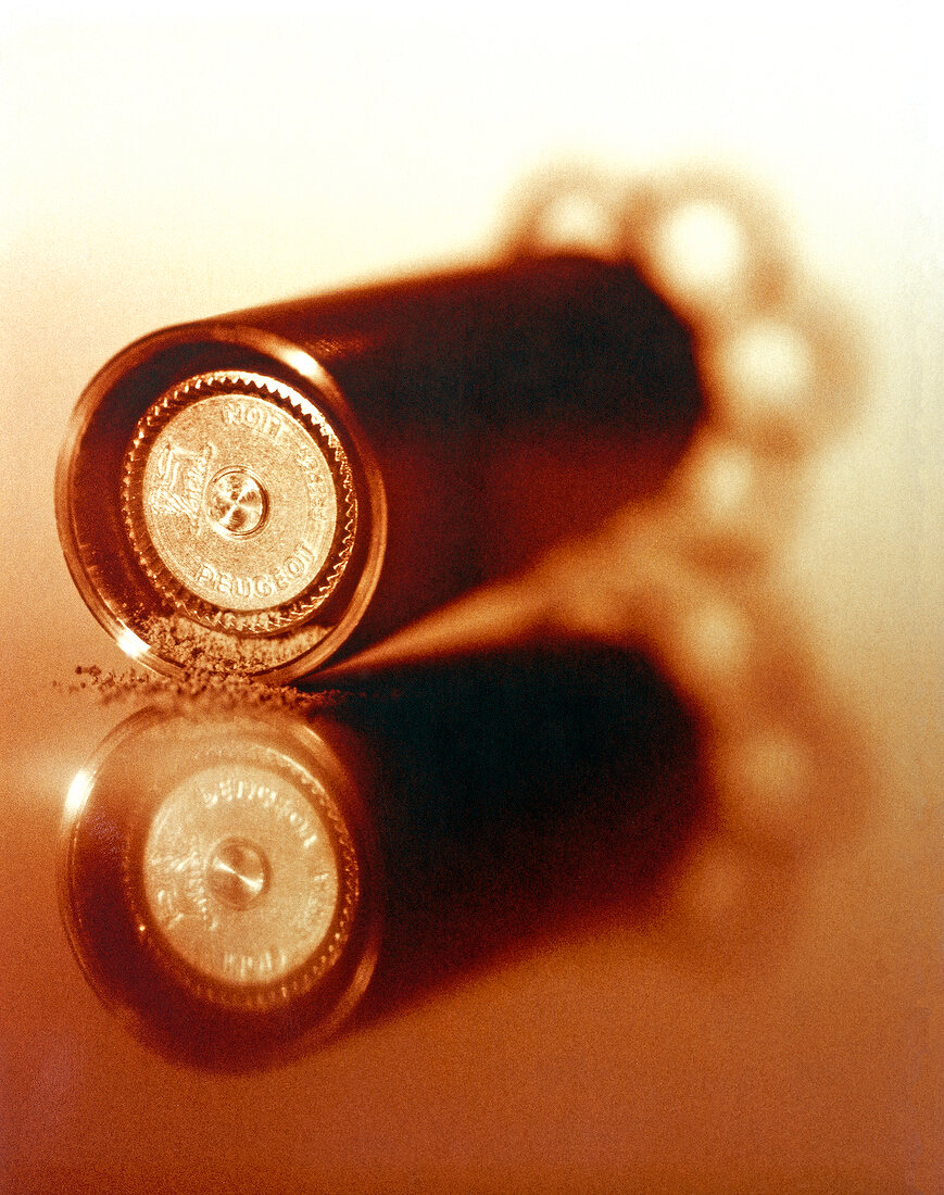 Close-up of ground pepper on pepper mills