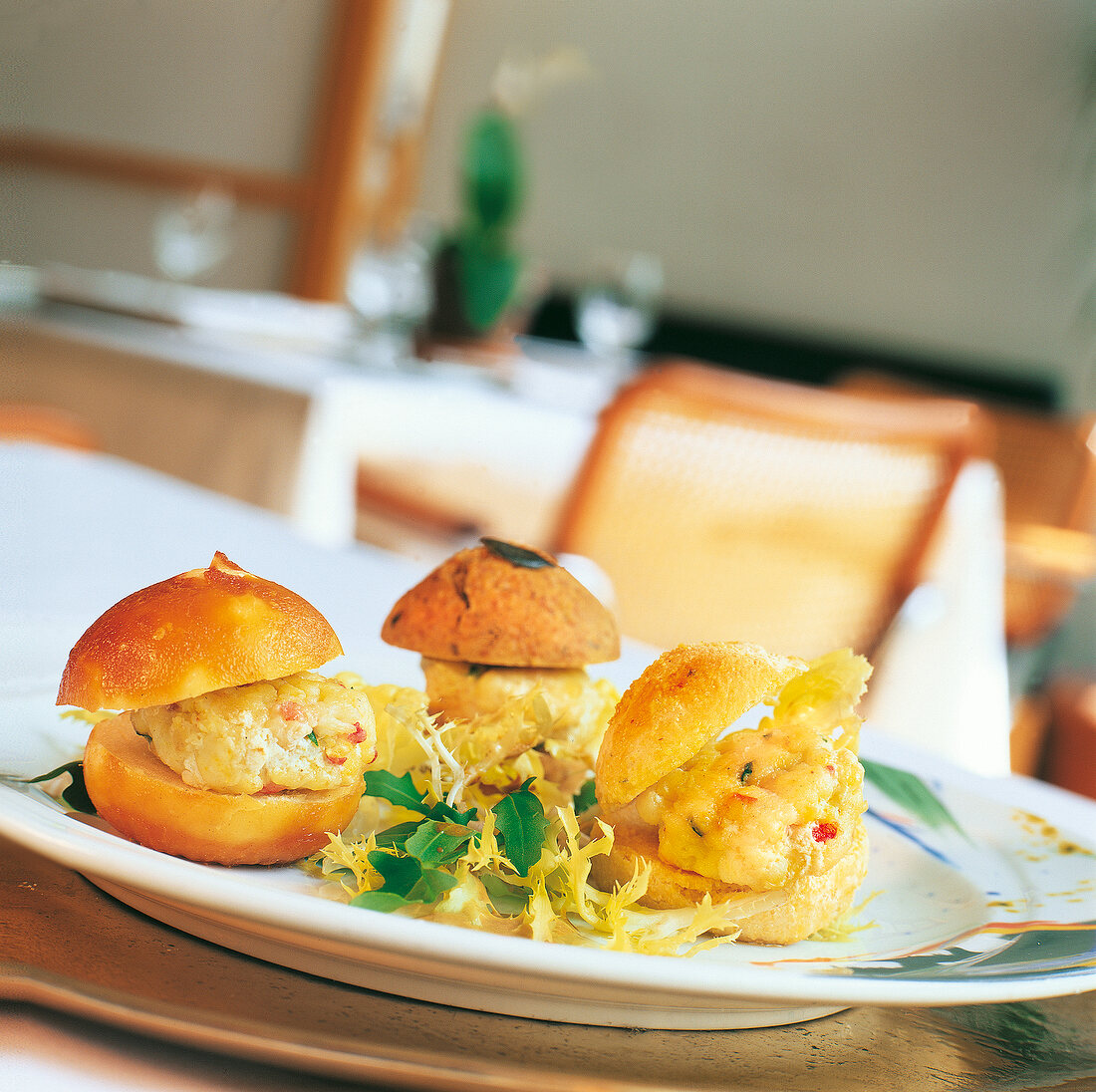 Turbot burger with lettuce leaves on plate