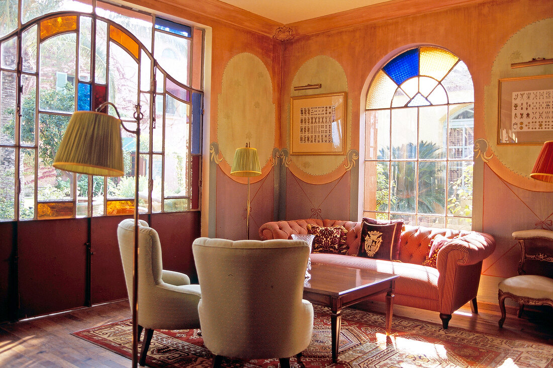 Sofa and table with side lamps in Hotel La Signoria, Corsica, Porto-Vecchio, France