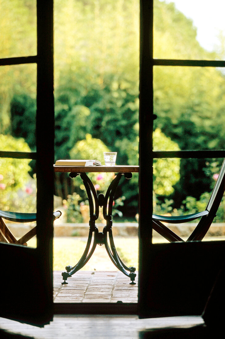 View of table and chair from door in Hotel La Signoria, Corsica, France