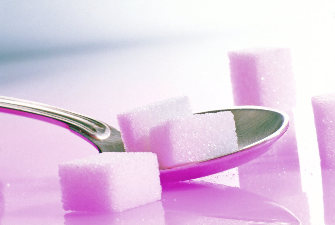 Close-up of sugar cubes on teaspoon