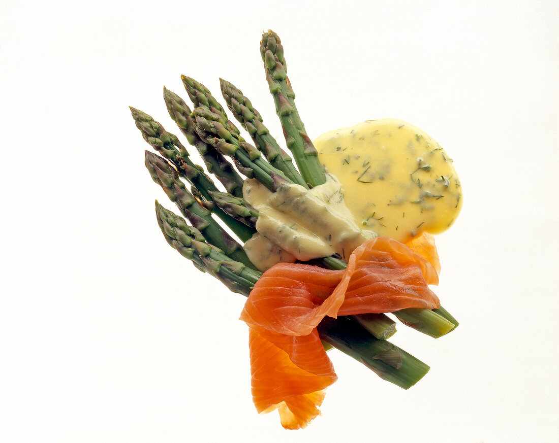 Close-up of Smoked salmon, green asparagus and hollandaise sauce with dill