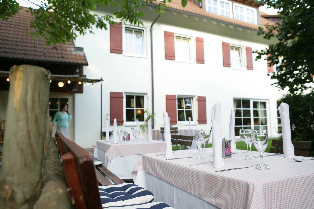 Tables laid outside restaurant, Germany