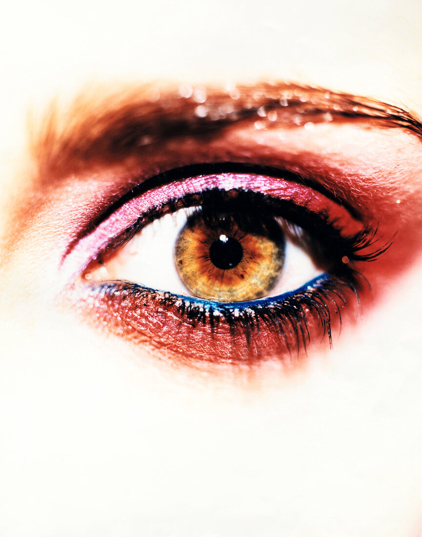 Close-up of woman's eye wearing heavy eye make-up