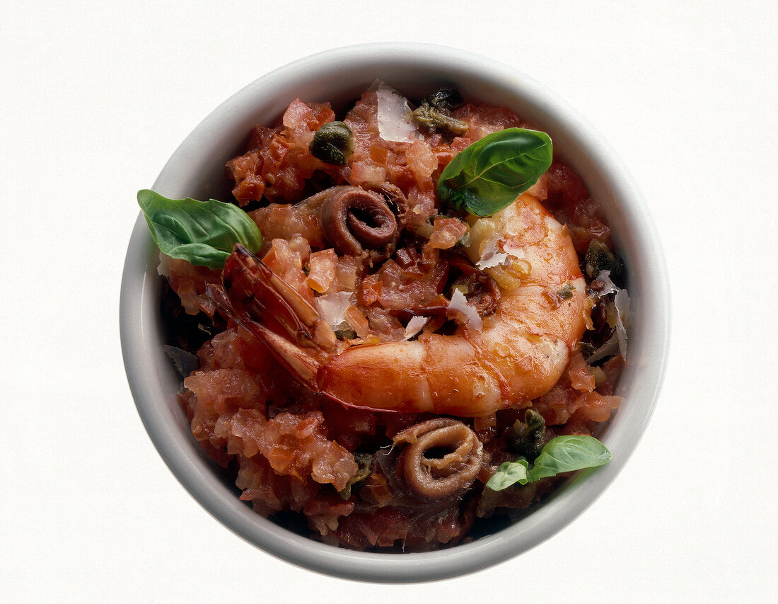 Shrimp and capers with negro pasta sauce in bowl