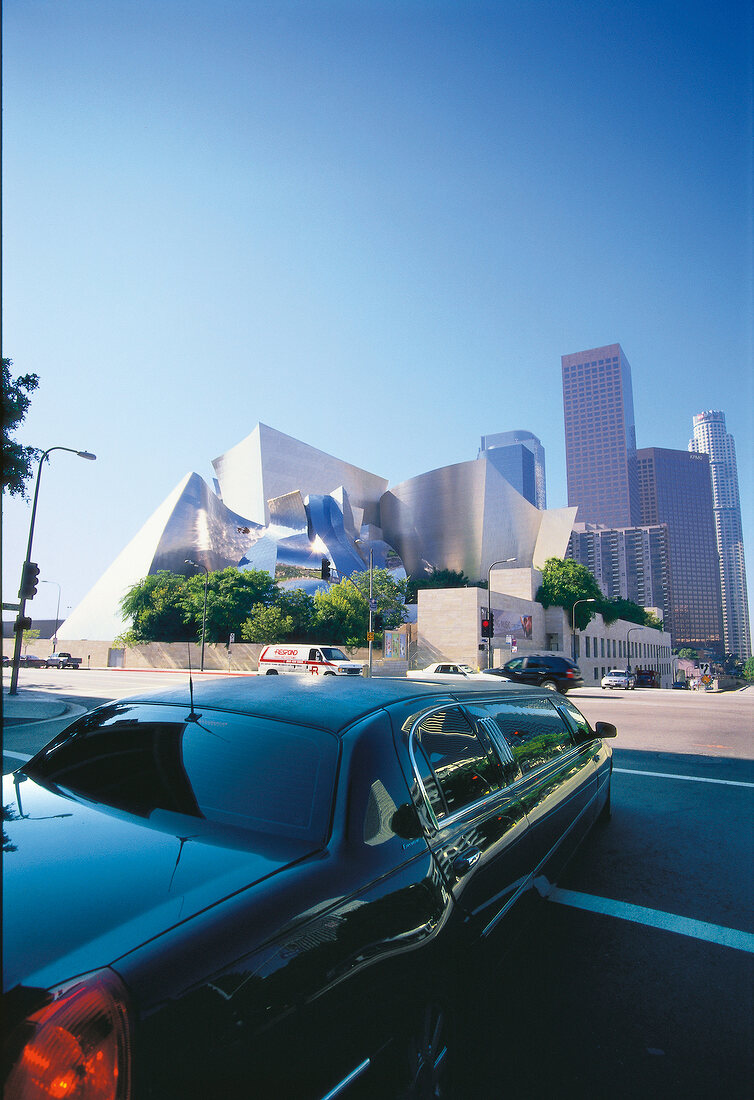View of black limousine and Walt Disney Concert Hall in background at Los Angeles, USA