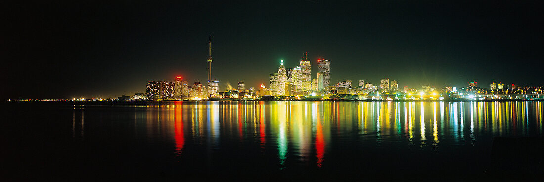View of illuminated skyline with reflection in water at Toronto, Ontario, Canada