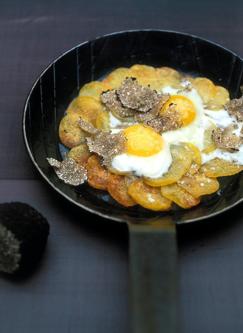 Pommes Anna with truffles in pan