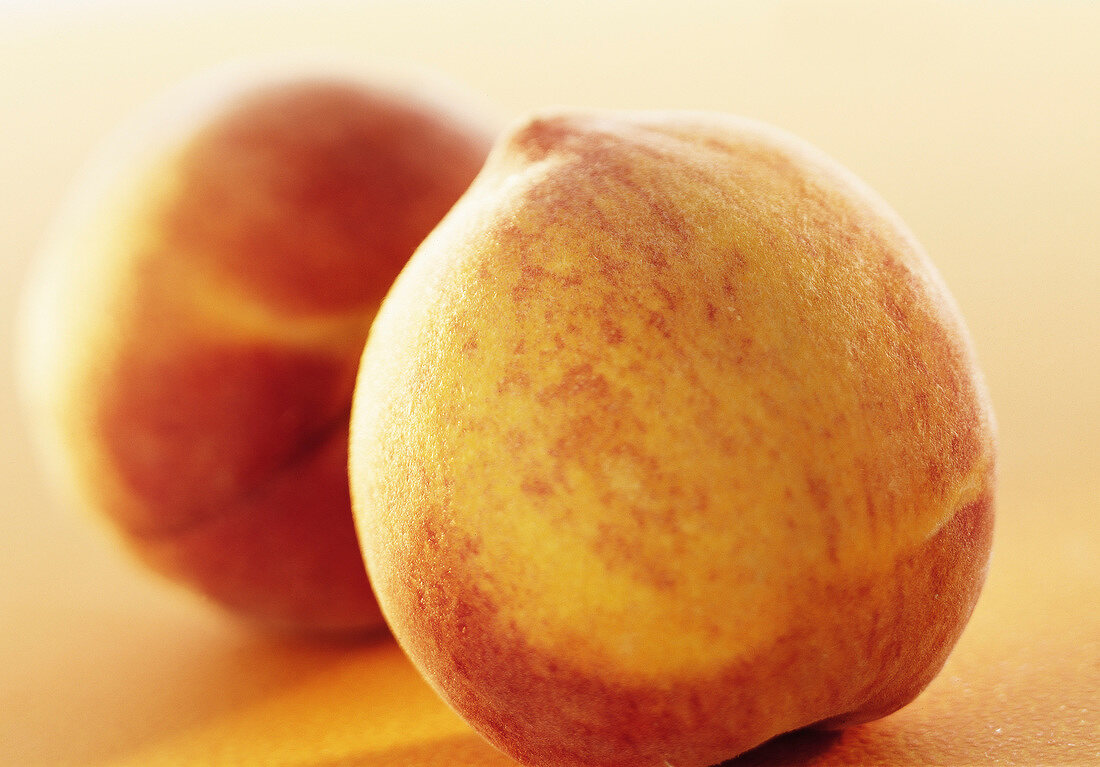 Close-up of two peaches