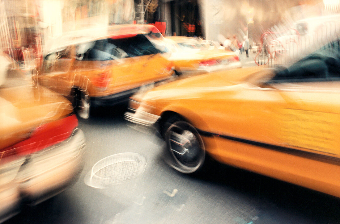 Yellow cars on the streets, blurred motion, New York, USA,
