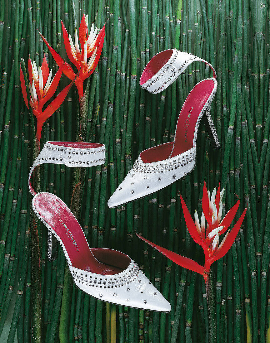 Red and white high heels stilettos decorated with paste stones on bamboos