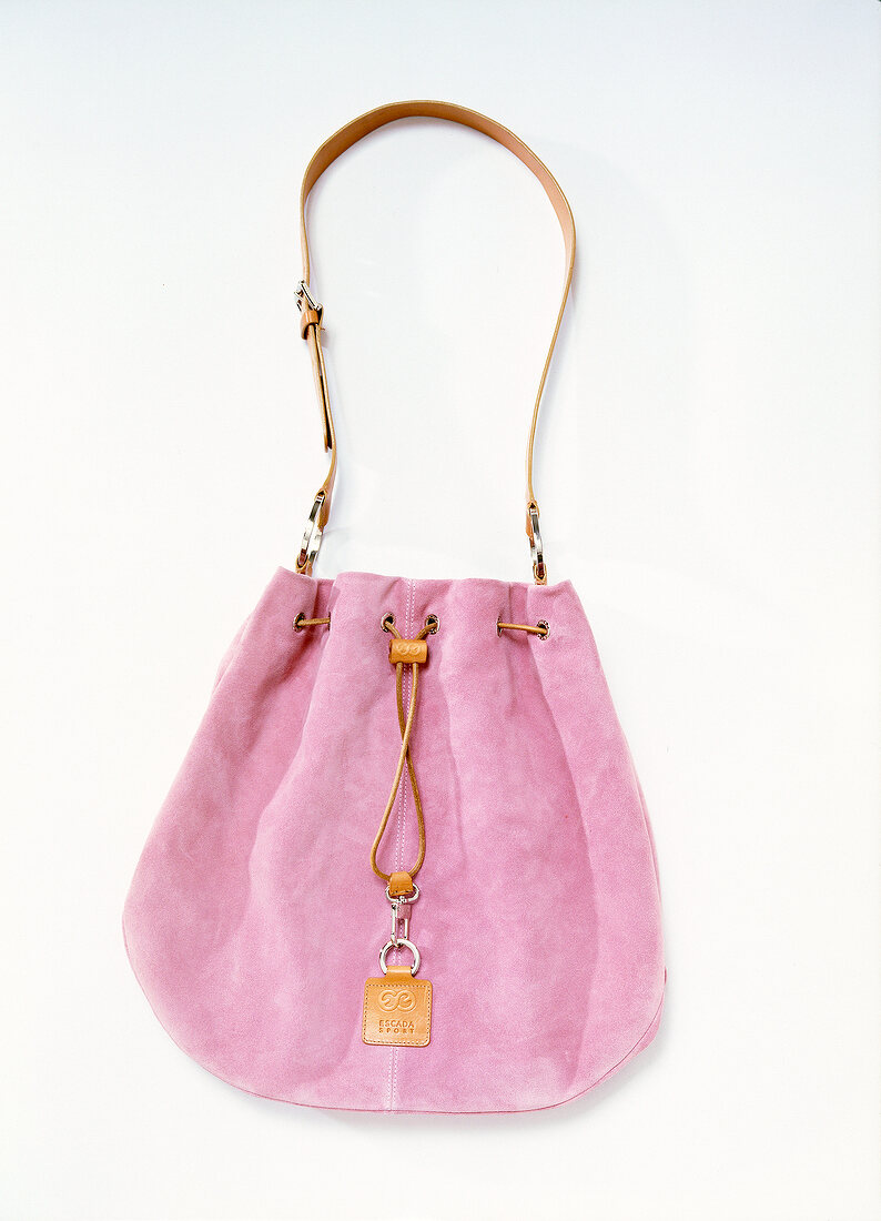 Close-up of pink pouch handbag on white background