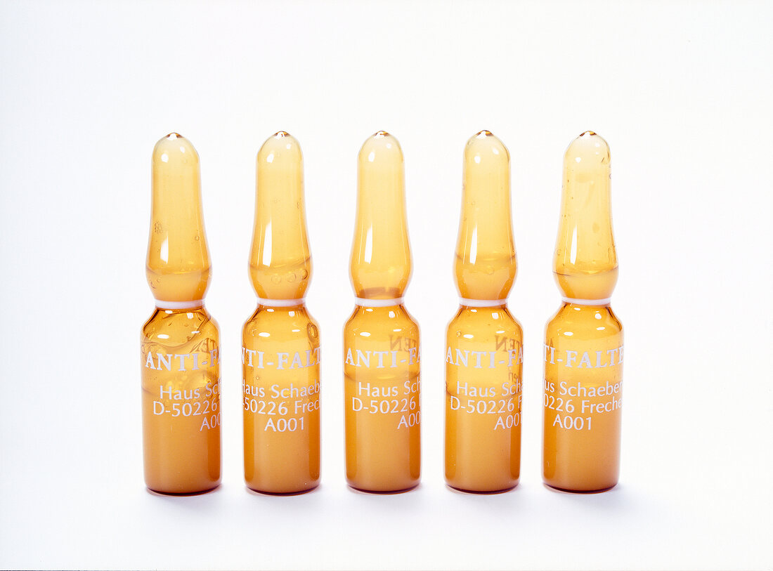 Anti-wrinkle ampoule on white background