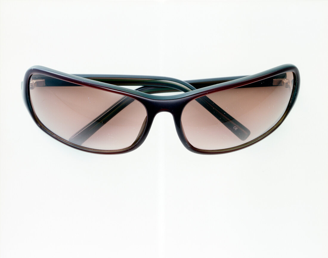 Close-up of plastic framed sunglasses on white background