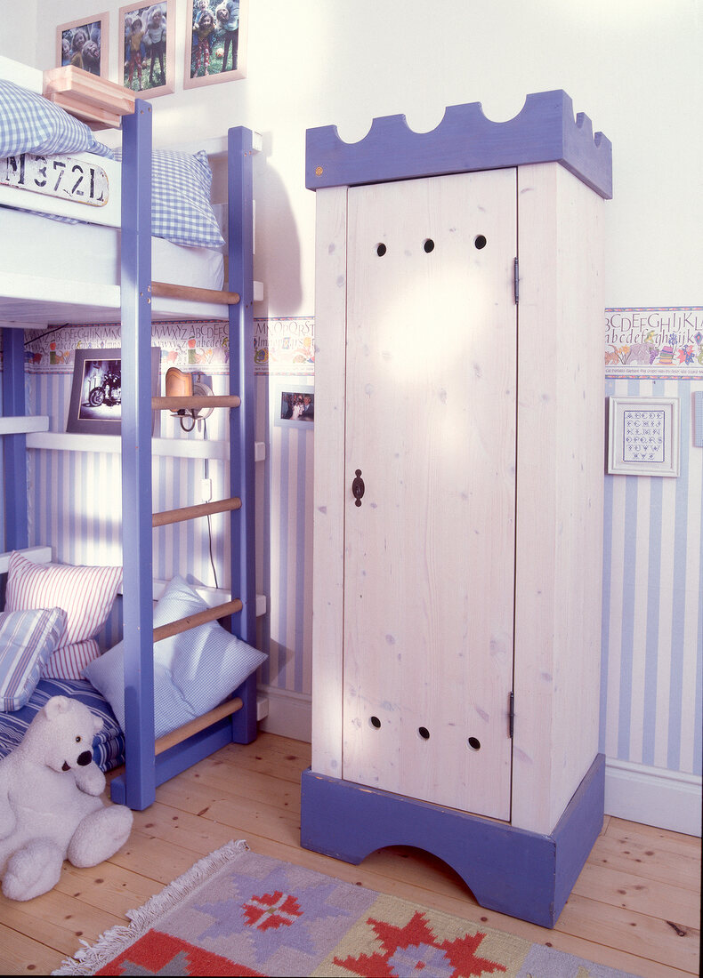 Castle shaped cabinet in blue and white in children's room