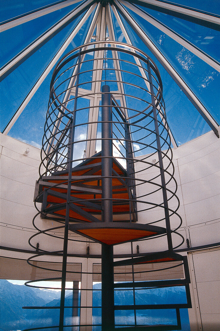 Spiral staircase under glass dome of house