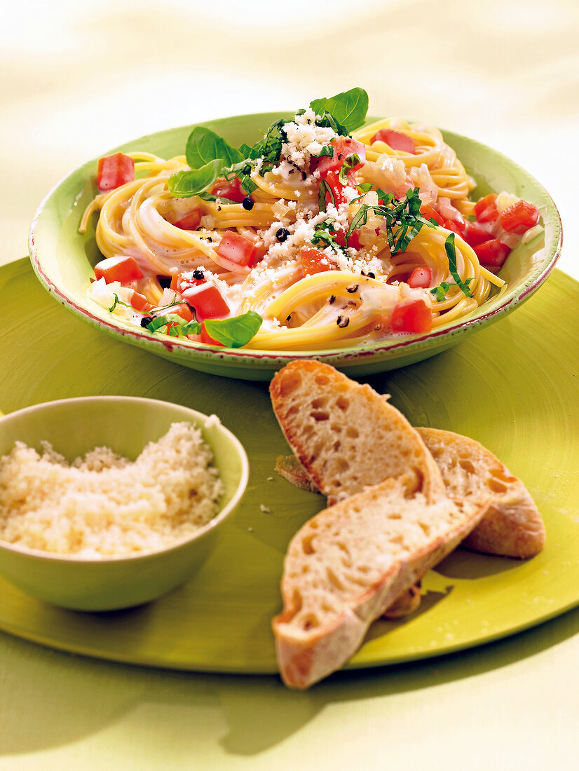 Spaghetti with goat cheese and carrot sauce in bowl