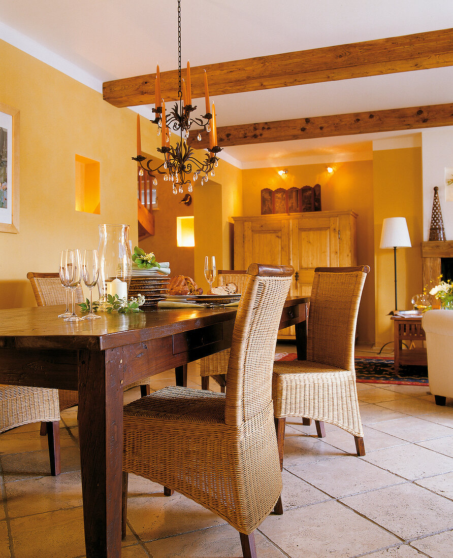 Beamed ceilings, dark table and braided chairs in Dining Room