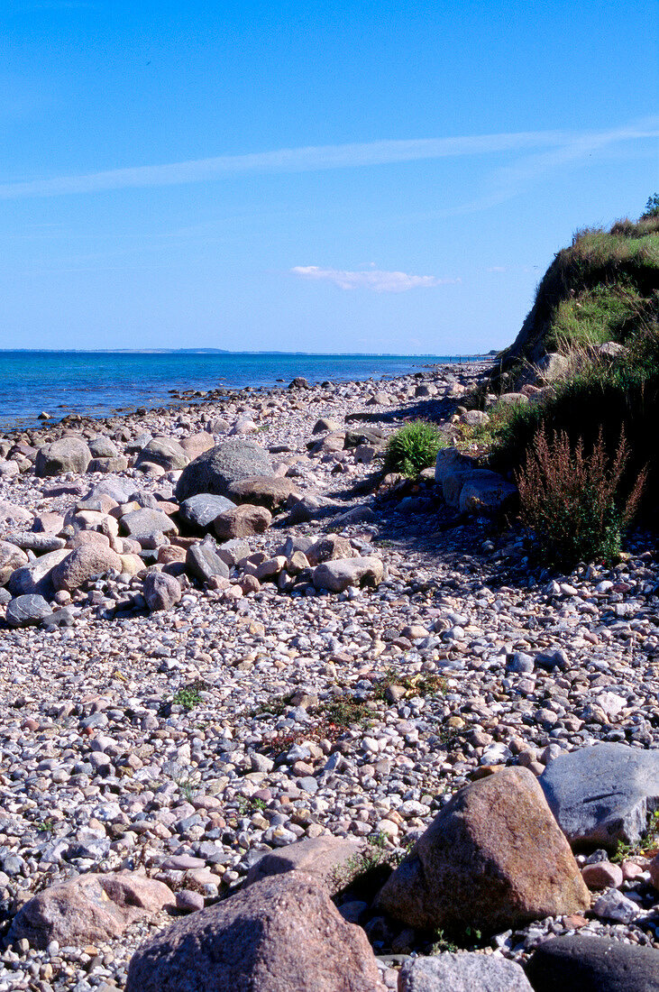 View of beach overlooking rocky shores near Baltic sea
