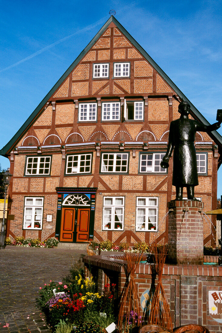 Fountain in front of half timbered house