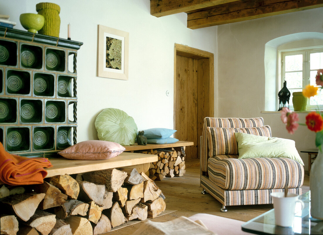 Wooden benches and stripe chair in living room