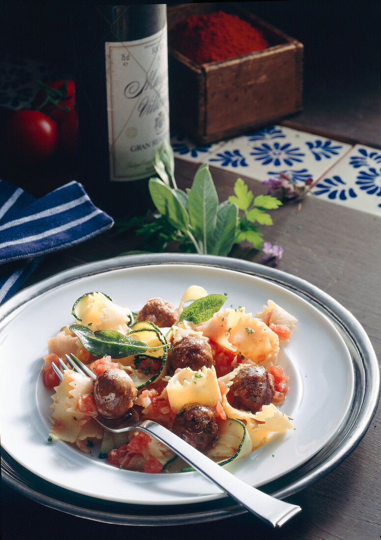 Fettuccine with meatballs on plate