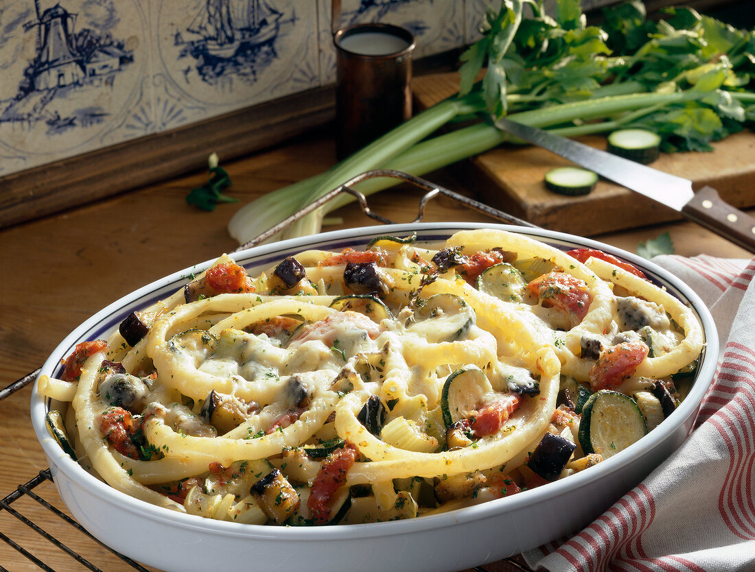 Pasta gratin with vegetables in serving dish