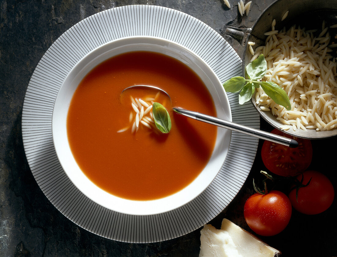 Tomato soup with noodles in bowl
