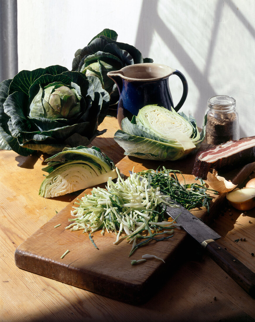 Chopped cabbage on wooden cutting board