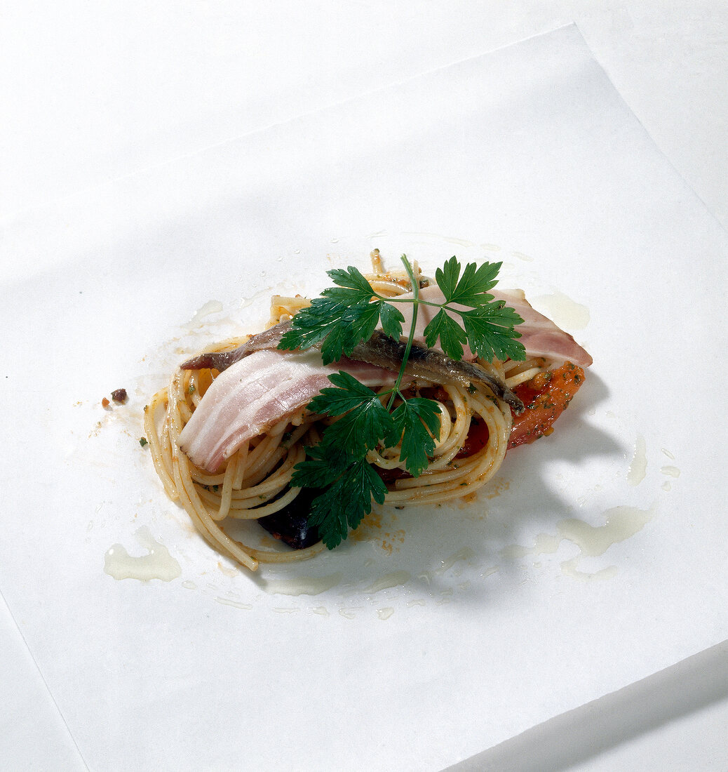 Noodles with herbs on parchment paper, step 2