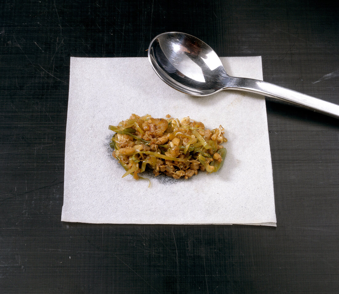 Filling on rice paper for preparation of spring rolls, step 3