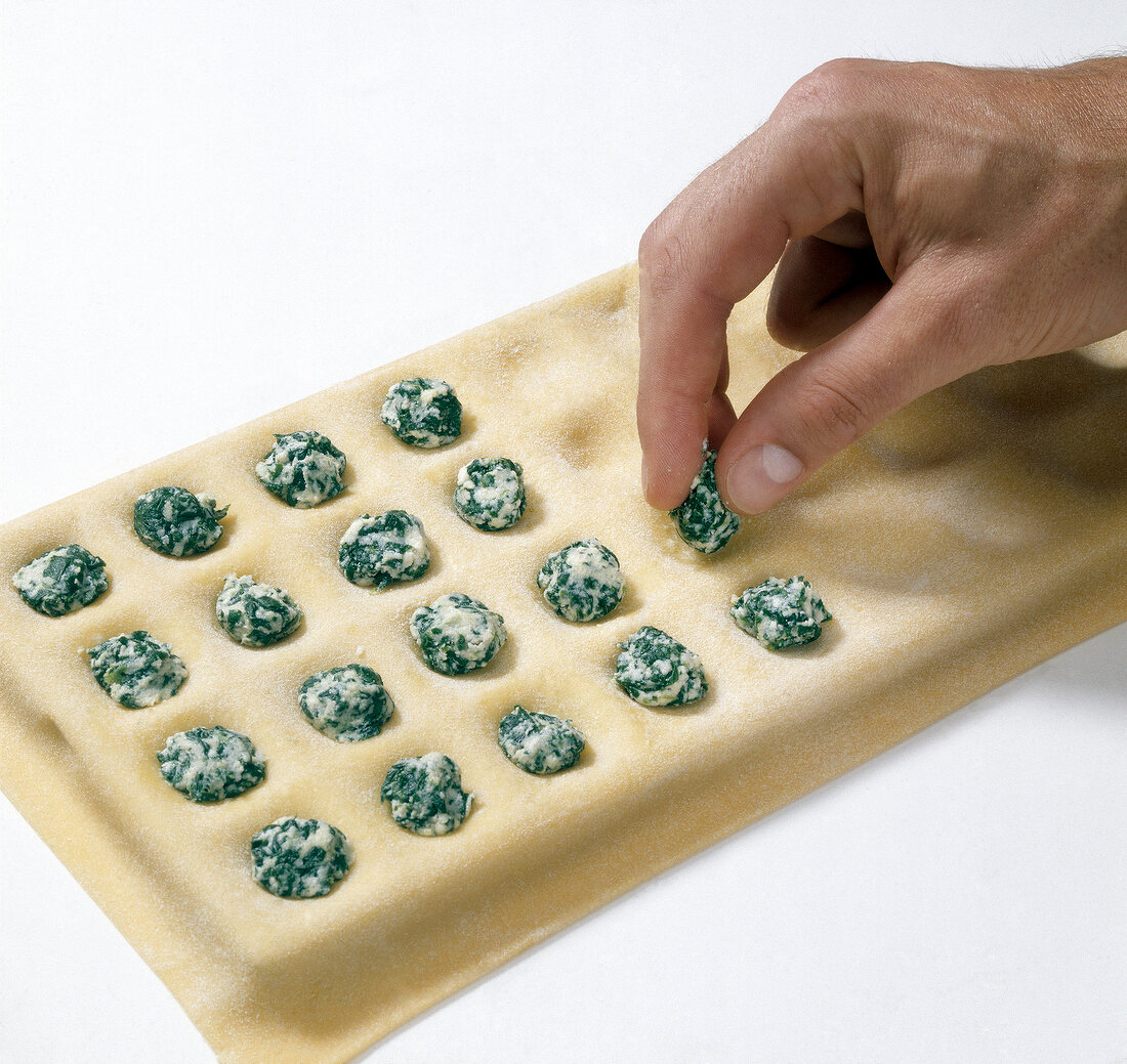 Filling being placed on dough sheet