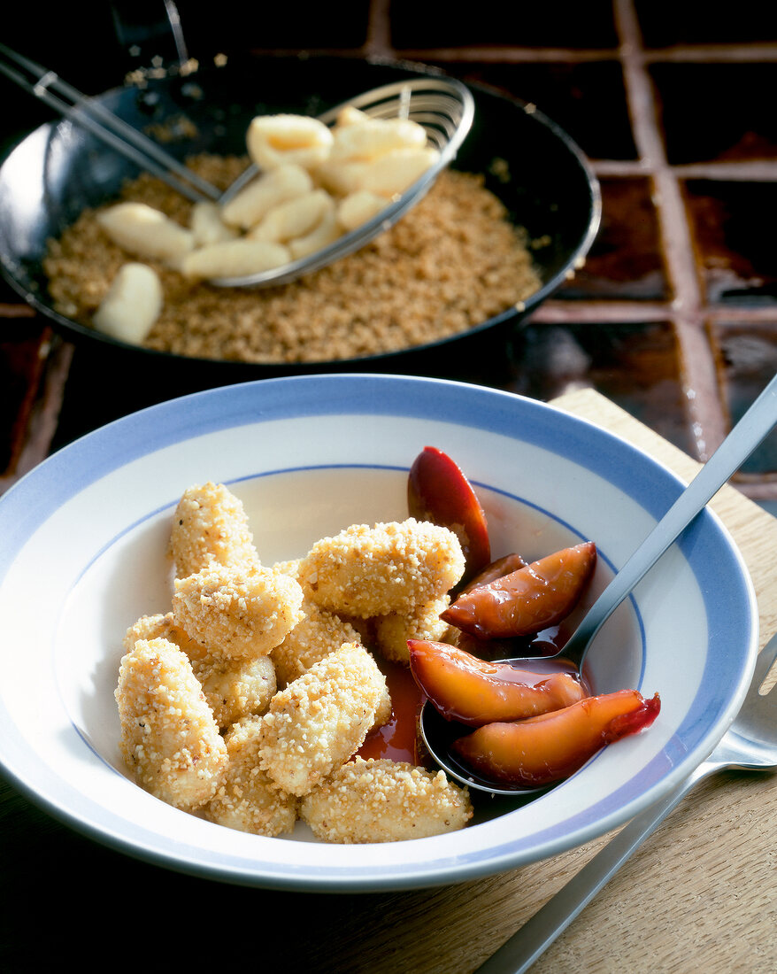 Hazelnut gnocchi with plum compote in bowl