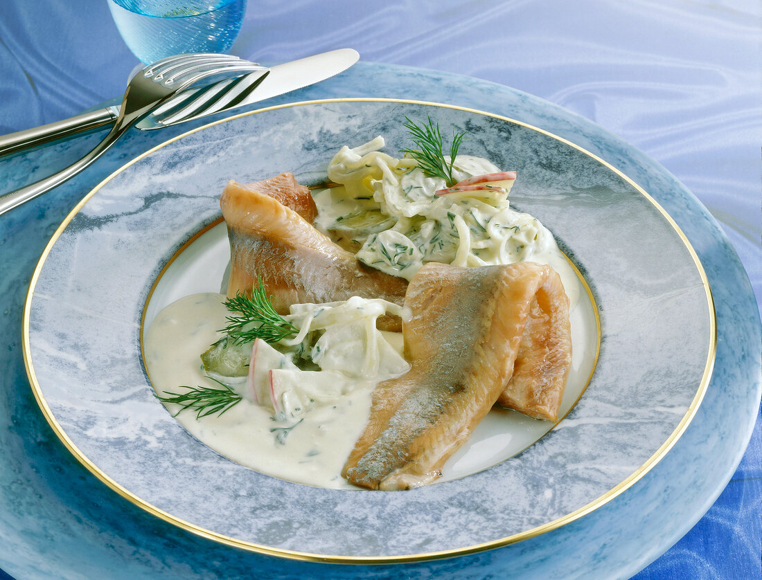 Close-up of herring in homestyle on plate