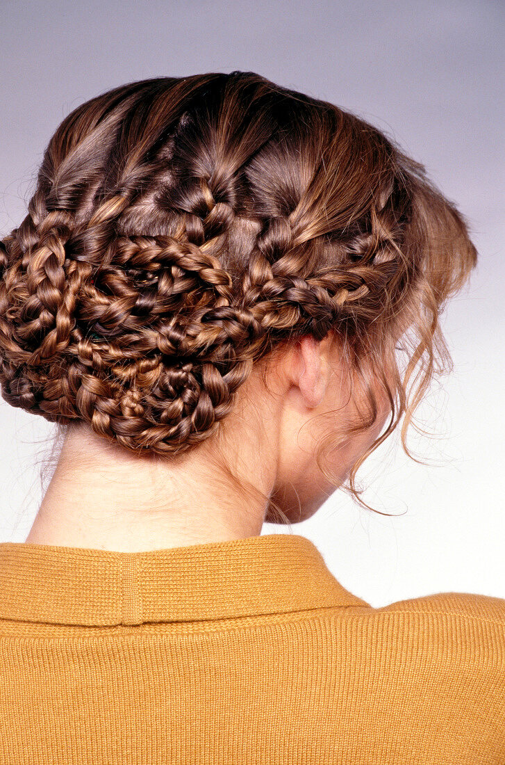 Rear view of woman with braided hair pinned up