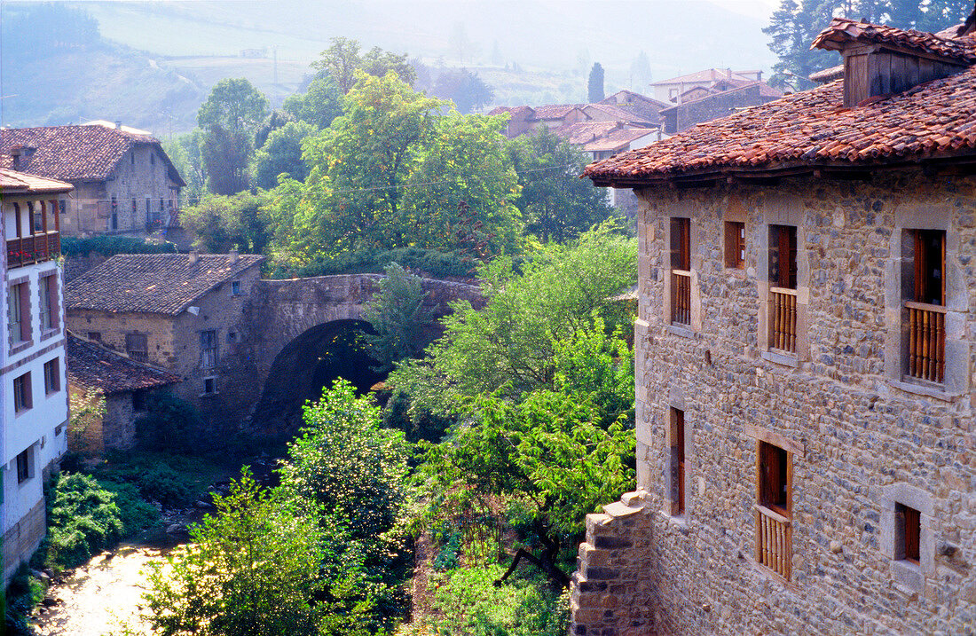 View of trees and houses of village Potes in Spain